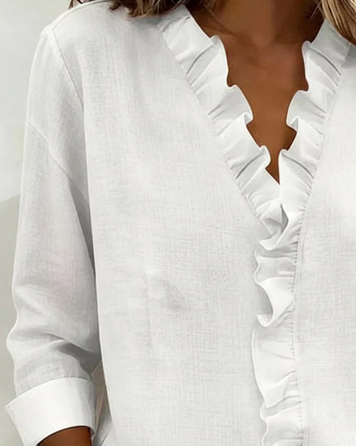 Amora | Blouse à volants, col en V et manches longues